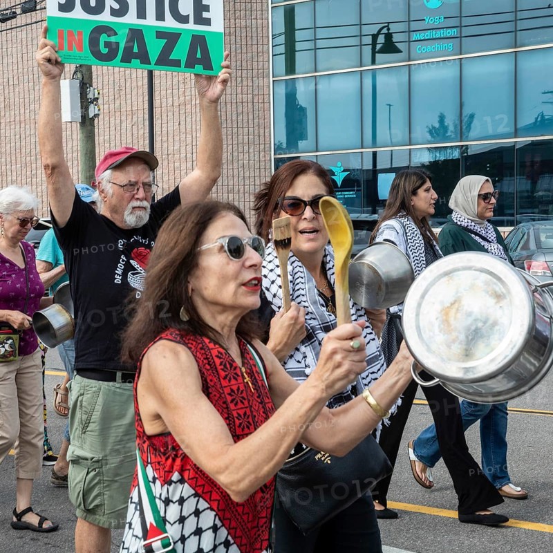 Detroit, Michigan USA - 26 July 2025 - Protesters rally at Eastern Market, banging empty pots to protest starvation in Gaza