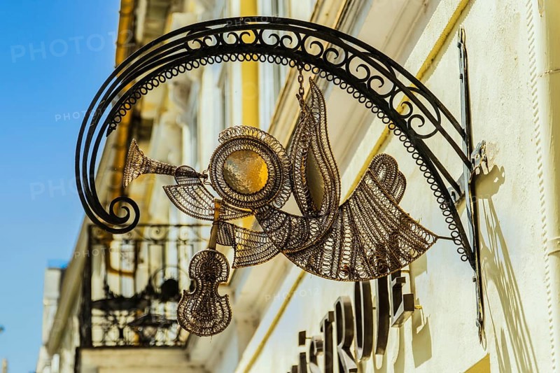 Hand-forged sign with instrument motif of a music shop, Capital of Culture 2026, Trencín, Slovakia