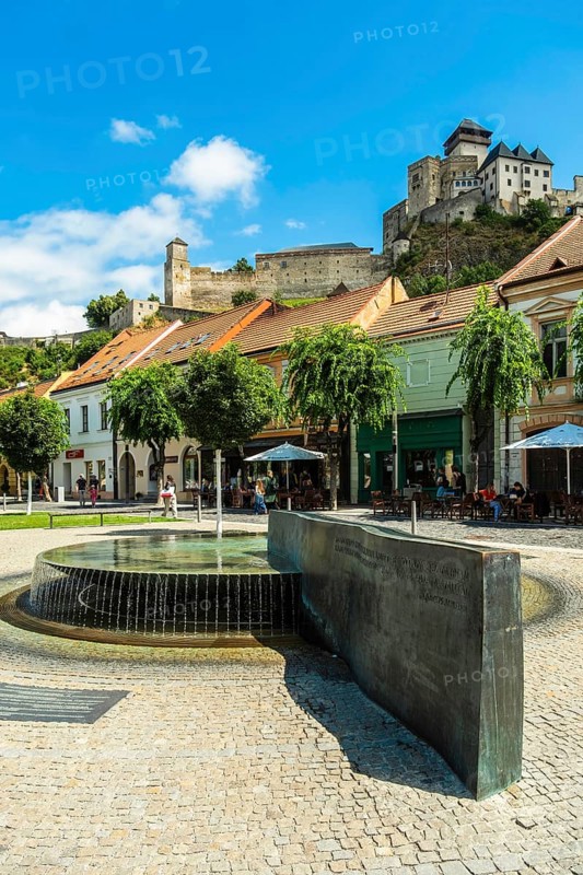 Mark Aurel fountain and fountain on Peace Square with Trencin Bridge in the background, Capital of Culture 2026, Trencín, Slovakia