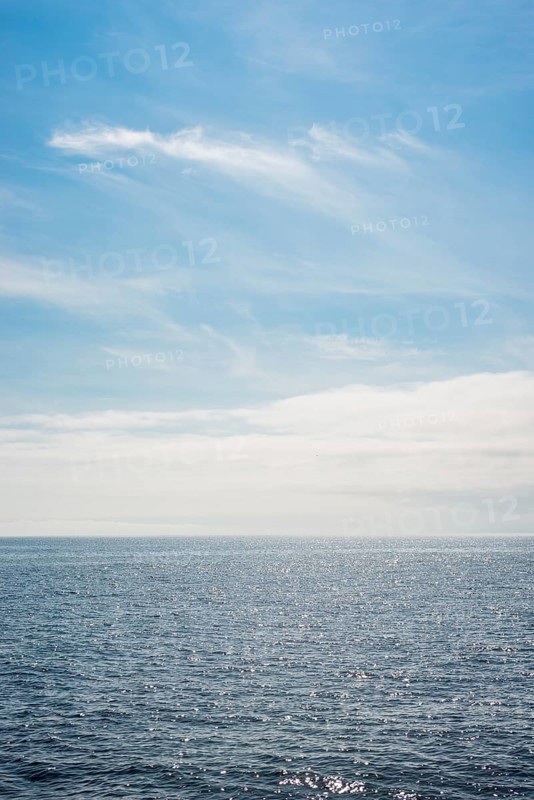 Dark ocean under a clear blue sky with bright white feathery clouds, cloud bank, horizon, water with light reflections, dark blue, light, reflection, sunny, water surface, summer, sunny, weather, calm sea, vastness, horizon, landscape, maritime, nature, relaxation, recreation, sunlight, freedom, sea voyage, too: threatening emptiness, being lost, infinite, infinity, nobody, alone, loneliness, journey with the Halunderjet from Heligoland to Hamburg, German Bight, North Sea, Germany
