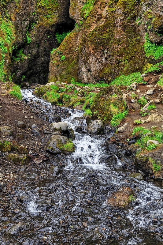Entrance to the mystical lava cave, Sönghellir lava tube, Cave of Songs, watercourse, Arnarstapi, Snaefellsjökull National Park, Snaefellsnes Peninsula, West Iceland, Iceland