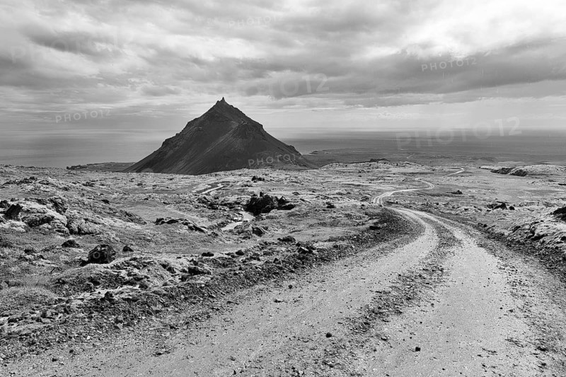 Barren mossy volcanic landscape, cone-shaped mountain Stapafell, monochrome, Arnarstapi, volcanic system Snaefellsjökull, peninsula, Snaefellsnes, West Iceland, Iceland