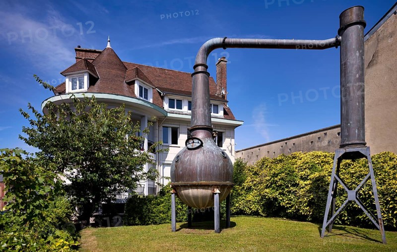Distillation plant, distillery, boiler, behind it art gallery Domaine Création, Fécamp, Normandy, Seine-Maritime, France