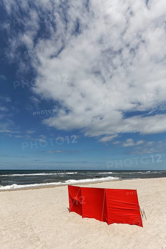Lonely beach with red windbreak, blue sky, Baltic Sea near Kühlungsborn, Mecklenburg-Western Pomerania, Germany