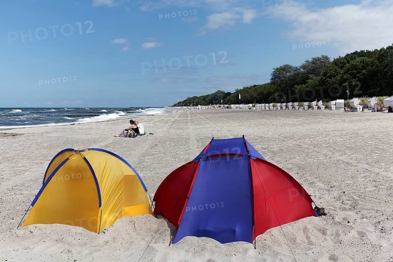 Two colourful beach shells, blue sky, Baltic Sea beach near Kühlungsborn, Mecklenburg-Western Pomerania, Germany