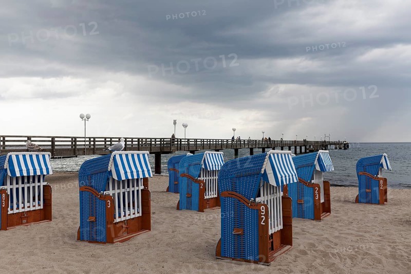Pier and beach with closed beach chairs, rain clouds, Kühlungsborn, Baltic Sea, Mecklenburg-Western Pomerania, Germany