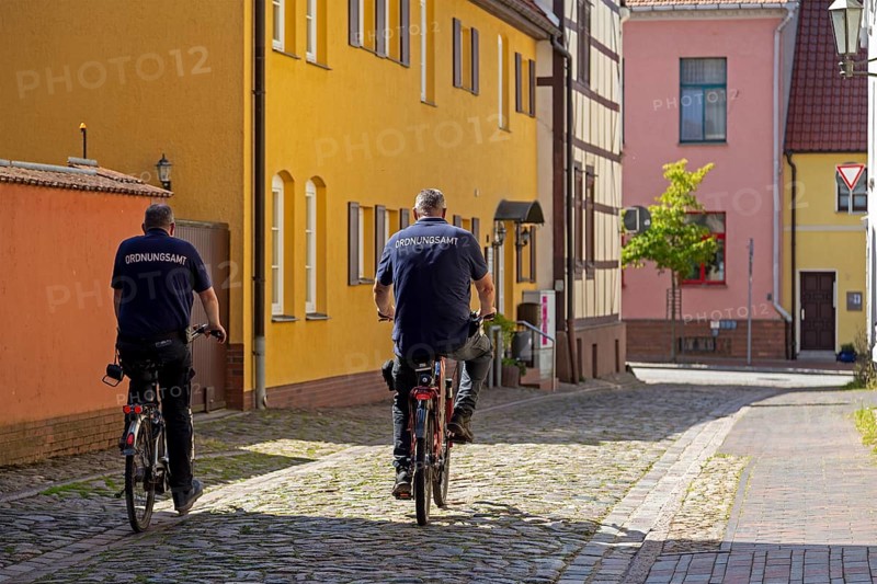Employees, public order office, cycling to work, Röbel, Müritz, Mecklenburg Lake District, Mecklenburg-Western Pomerania, Germany