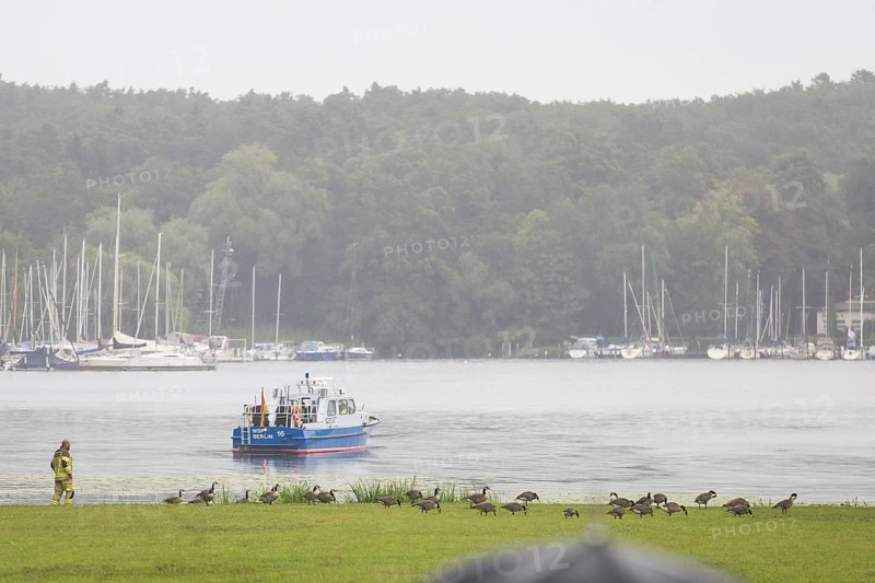 A water police boat guards the shore of Villa Borsig in front of a joint meeting between Friedrich Merz (CDU, German Chancellor) and Emmanuel Macron (President of the French Republic) at Villa Borsig in Berlin on 23 July 2025