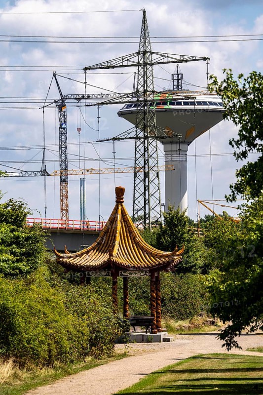 The Neulandpark in Leverkusen on the Rhine, state garden show site from 2005, Chinese dragon pavilion, Leverkusen water tower, landmark, high-voltage power lines, 20 hectares of parkland, with many playgrounds and sports fields, restaurants, hiking and cycling paths, south of the A1 motorway, North Rhine-Westphalia, Germany