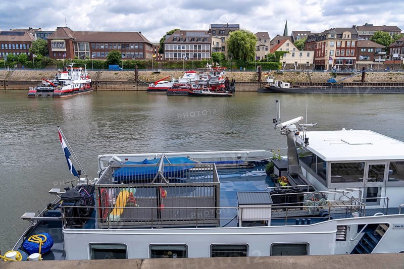 Barge, aft deck, with children's playground surrounded by a metal cage, for the safety of playing children, Ruhrort harbour, Duisburg, North Rhine-Westphalia, Germany