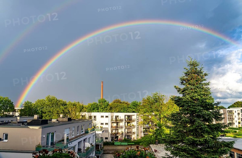 Rainbow after a thunderstorm over a residential neighbourhood in Essen-Rüttenscheid, North Rhine-Westphalia, Germany