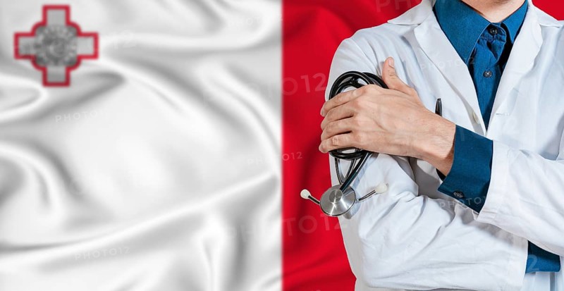 Doctor with stethoscope on Malta flag. Doctor holding stethoscope on Malta flag