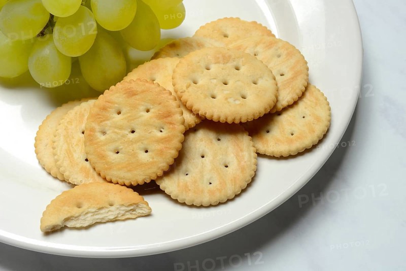 Crackers, crackers with grapes on a plate