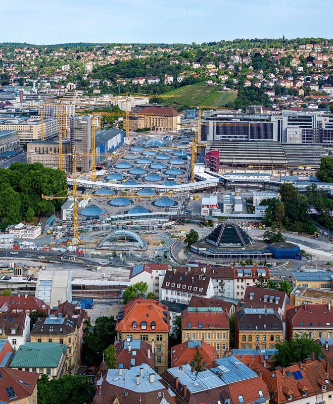 Stuttgart Central Station. The Stuttgart 21 construction site, where the new through station is being built. The 27 skylights that naturally illuminate the future through station are a characteristic feature. On the right are the current platforms of the current terminus station, at the front left the south surge structure for the ventilation of the underground platform hall. Stuttgart, Baden-Württemberg, Germany