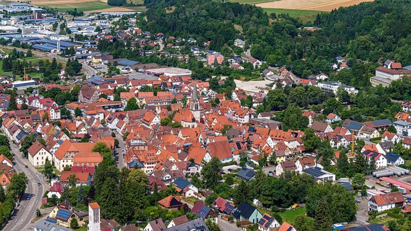 Town view of Münsingen on the Swabian Alb with town hall and church. Drone photo. Town centre of Münsingen, Baden-Württemberg, Germany