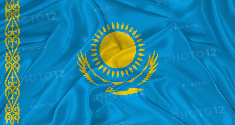 Flag of Kazakhstan with cloth texture. Close up of Kazakh flag waving