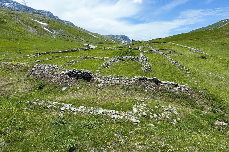 Foundation walls ruins of 2000 year old historical ancient Roman hostel Mansio at the top of the Alpine pass Colle del Piccolo San Bernardo, Col du Petit Saint Bernard Little Saint Bernard Pass in Alps, Aosta Valley region, Italy