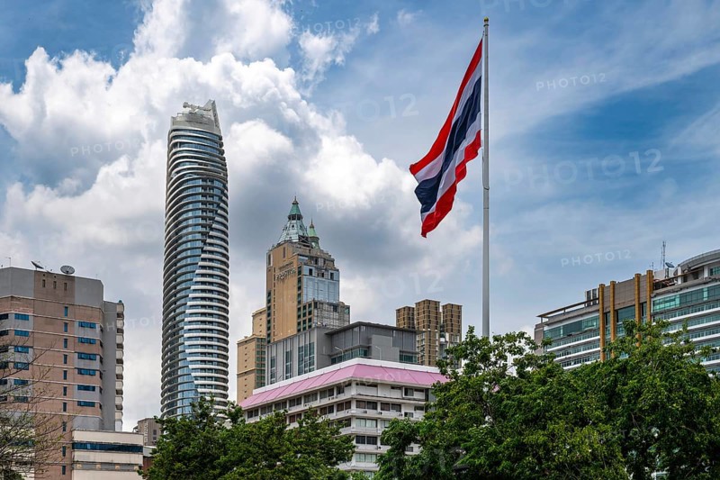 Thailand flag and Magnolias Ratchadamri Boulevard Residence, Bangkok, Thailand