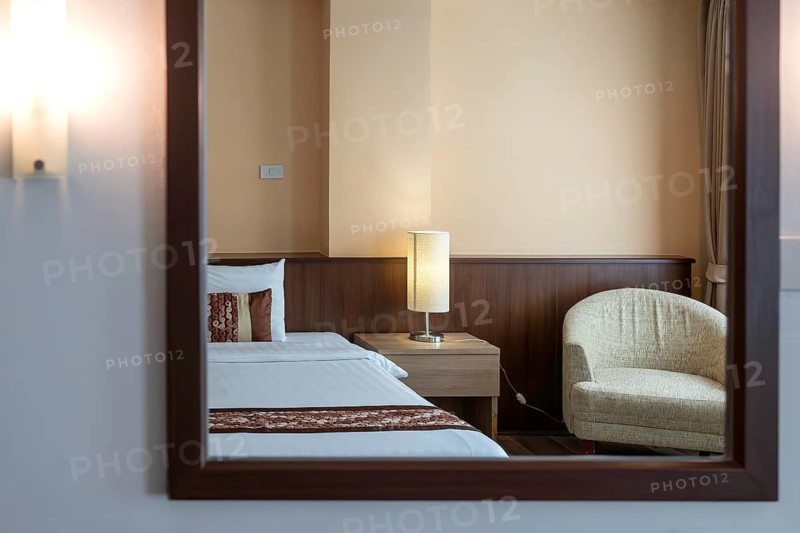 Symbol photo hotel room mirror bed