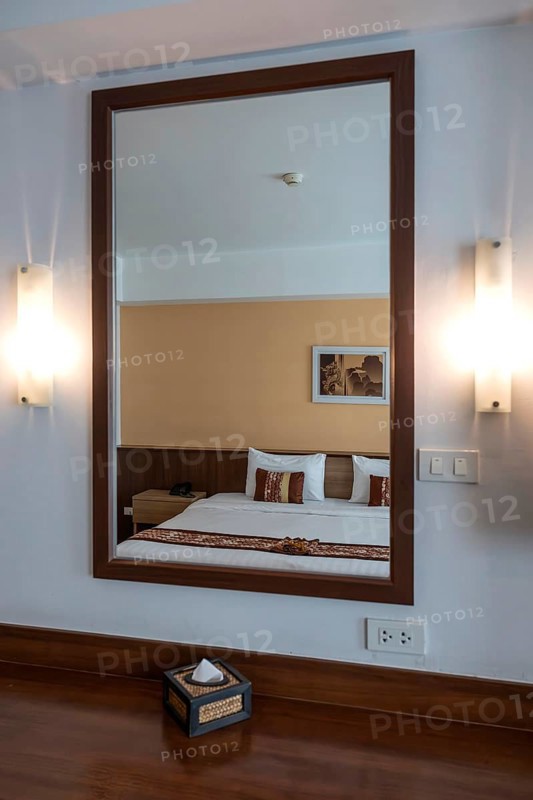 Symbol photo hotel room mirror bed