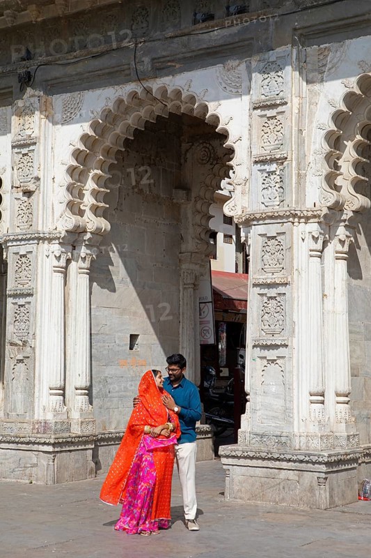 Indian couple at Gangaur Ghat or Gangori Ghat, Udaipur, Rajasthan, India