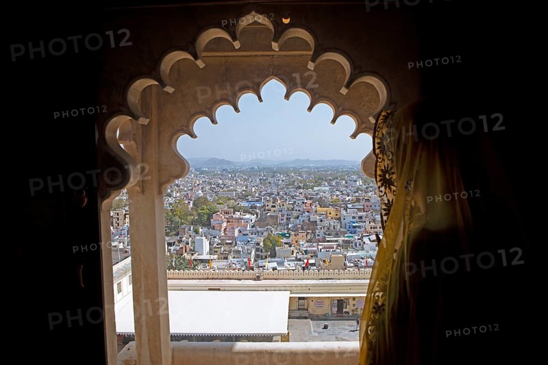 Indian woman with headscarf looking at the city, City Palace Museum, City Palace or City Palave, Udaipur, Rajasthan, India