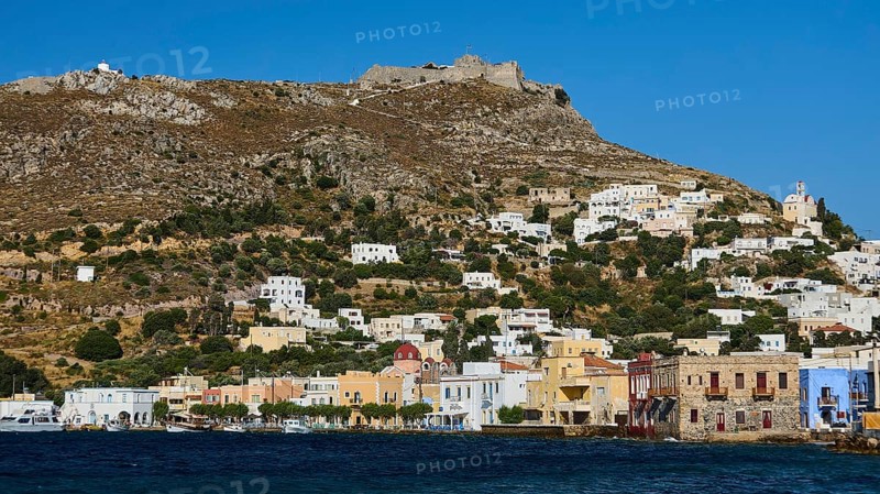 Panteli Fortress, view of a coastal town with hills and colourful houses on the shore of the blue sea, Agia Marina, Leros, Dodecanese, Greek Islands, Greece