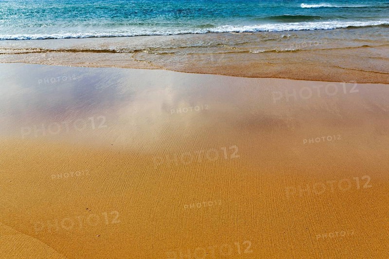 Orange-red lonely beach Raudisandur, fine structures in the sand, turquoise blue sea, Rauðisandur, coastline near Patreksfjördur, Vestfirðir, Westfjords, Iceland