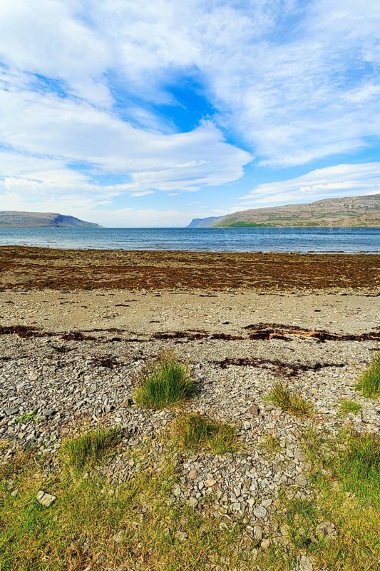 Fjord landscape with pebble beach, Skápadalur valley, coastline, Patreksfjördur, Vestfirðir, Westfjords, Iceland