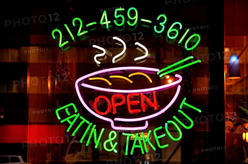 Illuminated advertising at a fast food restaurant, New York City, USA