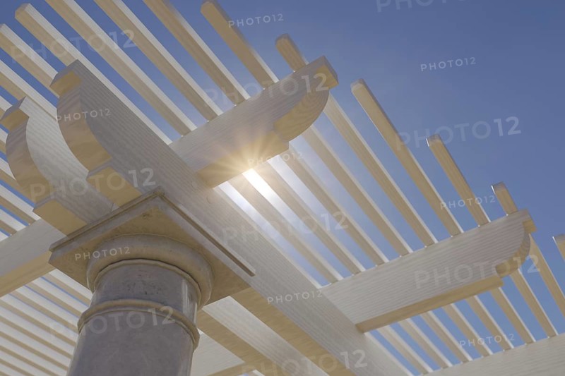 Detail abstract of A beautiful marble and wood pergola patio cover