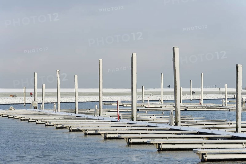 Winter day, onset of winter, snow on the jetties in the marina, North Sea, Norddeich, Lower Saxony, Germany