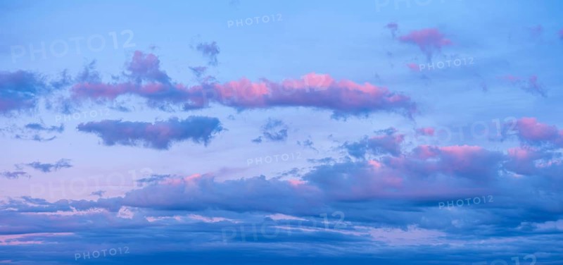 Background image for sky replacement, evening sky with pink clouds at dusk after sunset