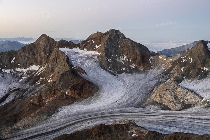 High mountain landscape at sunrise, glacier and rocky mountain peaks, view of the Königshofspitz mountain peak and Übeltalferner glacier, Stubai Alps, South Tyrol, Italy