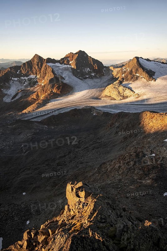 Picturesque high mountain landscape at sunrise with alpenglow, glacier and rocky mountain peaks in the morning light, view of the Königshofspitz mountain peak and Übeltalferner glacier, Stubai Alps, South Tyrol, Italy