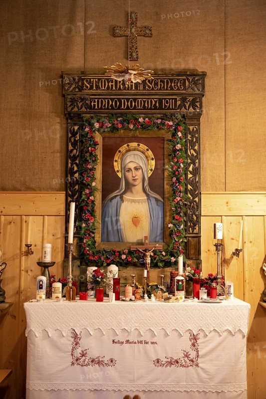 Interior view, small chapel with altar and image of the Virgin Mary, Maria im Schnee chapel, at the summit of the Becher, Stubai Alps, South Tyrol, Italy
