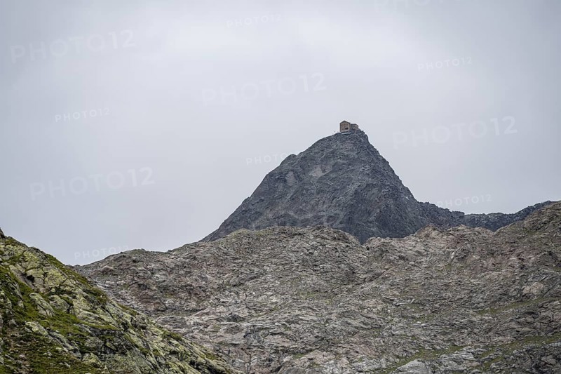 Becherhaus mountain hut on the rocky summit of the Becher, Stubai Alps, near Ridnaun, South Tyrol, Italy