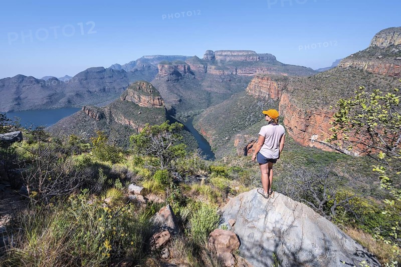 Hiker enjoying panorama, Blyde River Canyon with summit Three Rondawels, view of canyon with river Blyde River and table mountains, canyon landscape, Panorama Route, Mpumalanga, South Africa