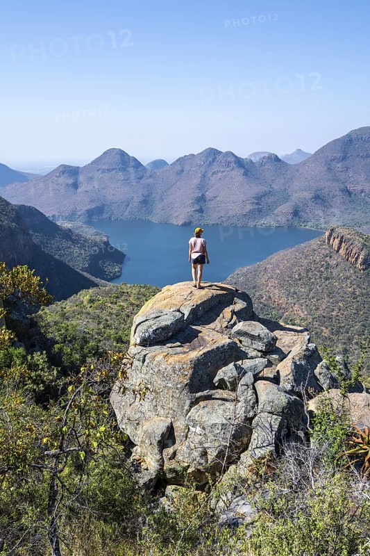 Hiker enjoying panorama, Blyde River Canyon with summit Three Rondawels, view of canyon with river Blyde River and table mountains, canyon landscape, Panorama Route, Mpumalanga, South Africa