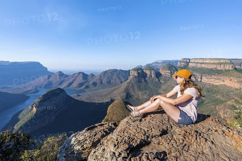Hiker enjoying panorama, Blyde River Canyon with summit Three Rondawels, view of canyon with river Blyde River and table mountains, canyon landscape, Panorama Route, Mpumalanga, South Africa