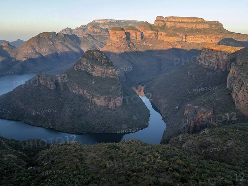 Sunset at Blyde River Canyon with Three Rondawels peak, view of canyon with Blyde River and table mountains in the evening light, canyon landscape, Panorama Route, Mpumalanga, South Africa