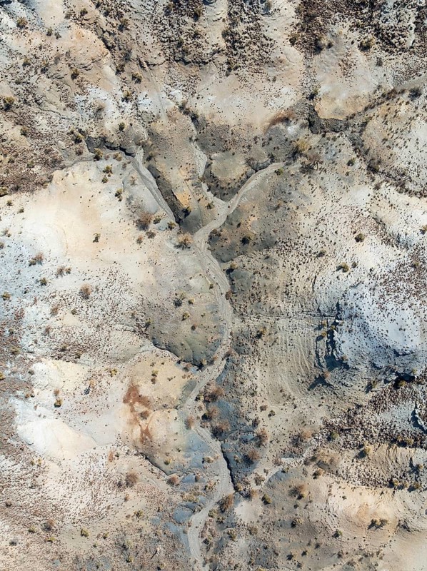 Broken, rocky ground with sparse vegetation. Aerial view. Drone shot. Southern Namibia