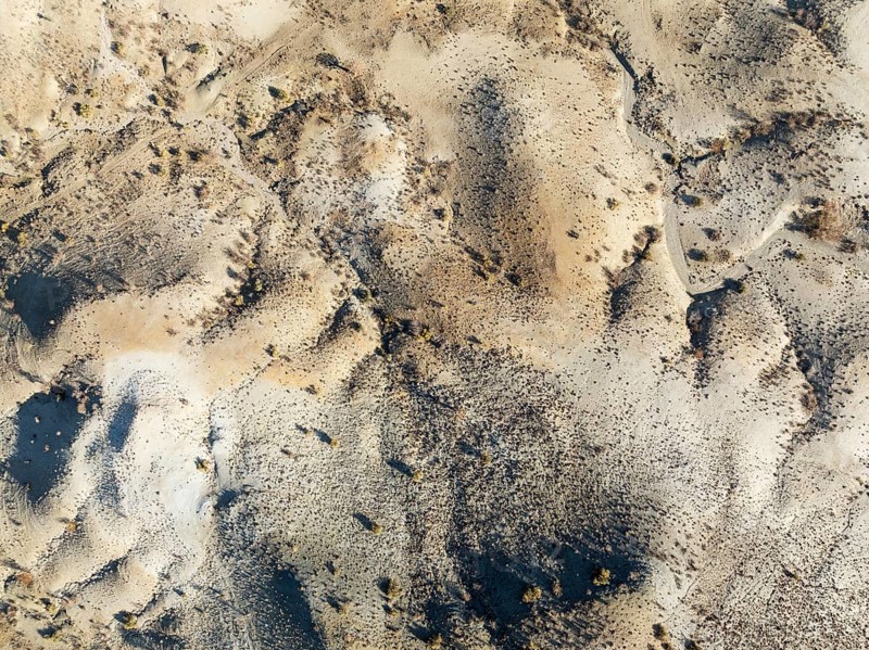Broken, rocky ground with sparse vegetation. Aerial view. Drone shot. Southern Namibia