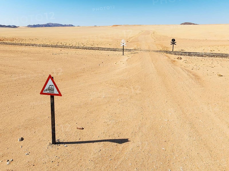 Rails and level crossing in the southern Namib Desert. Aerial view. Drone shot. Namibia