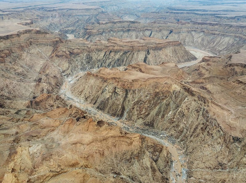 The Fish River Canyon with a length of 160 km is the second largest canyon in the world and the largest in Africa. Aerial view. Drone shot. Ai-Ais Richtersfeld Transfrontier Park, Namibia
