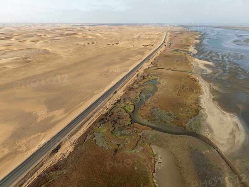 The Walvis Bay Lagoon between Namib Desert and Atlantic Ocean at low tide. Aerial view. Drone shot. Namibia