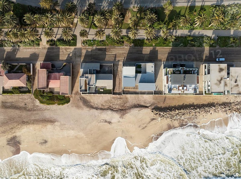 Upmarket seaside villas at the coastal town of Swakopmund between Namib Desert and Atlantic Ocean. Aerial view. Namibia