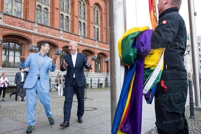 Kai Wegner (Governing Mayor of Berlin) and Florian Winkler-Schwarz, Managing Director of the Lesbian and Gay Federation (LSVD) Berlin Brandenburg laugh on the way to the raising of the rainbow flag for Pride Week in front of the Rotes Rathaus in Berlin on 9 July 2025