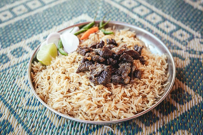 Traditional camel restaurant in Salalah, dry braised camel meat on rice, Dhofar, Oman