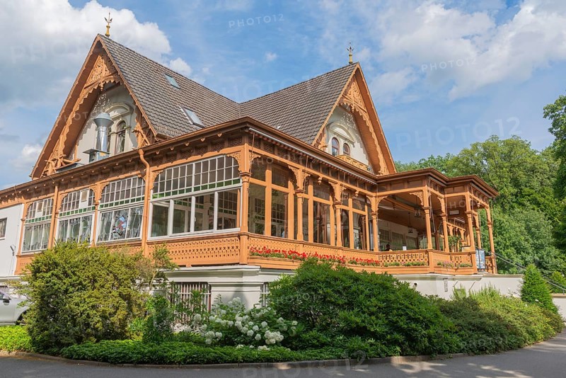 Meierei in the Bürgerpark from 1866, catering, veranda, landscape park with rivers and lakes, garden monument, attraction, recreation, groups of trees, blue sky, city state of Bremen, Germany